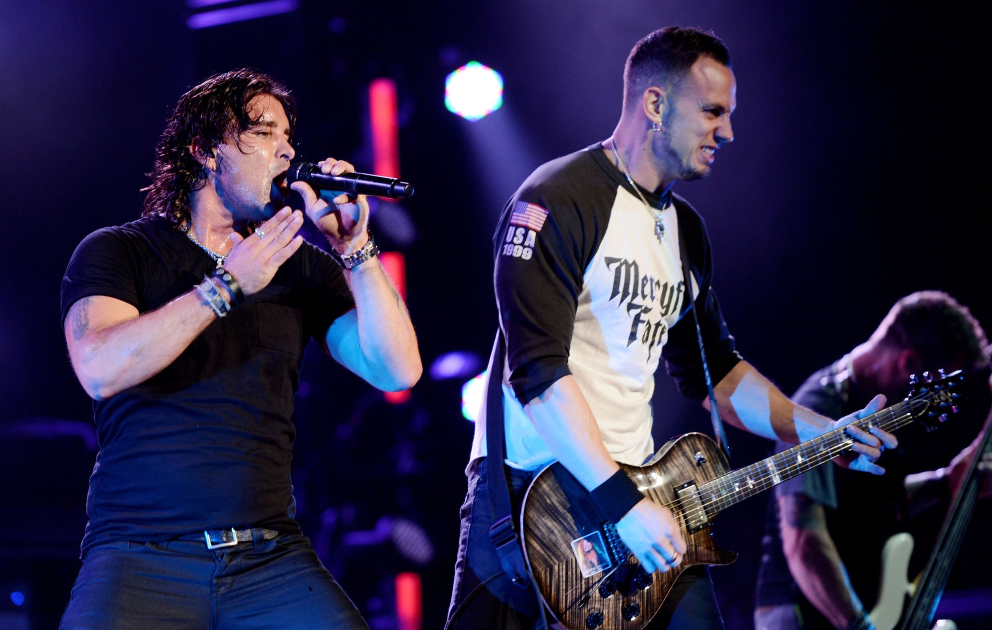 Scott Stapp (L) and guitarist Mark Tremonti of Creed